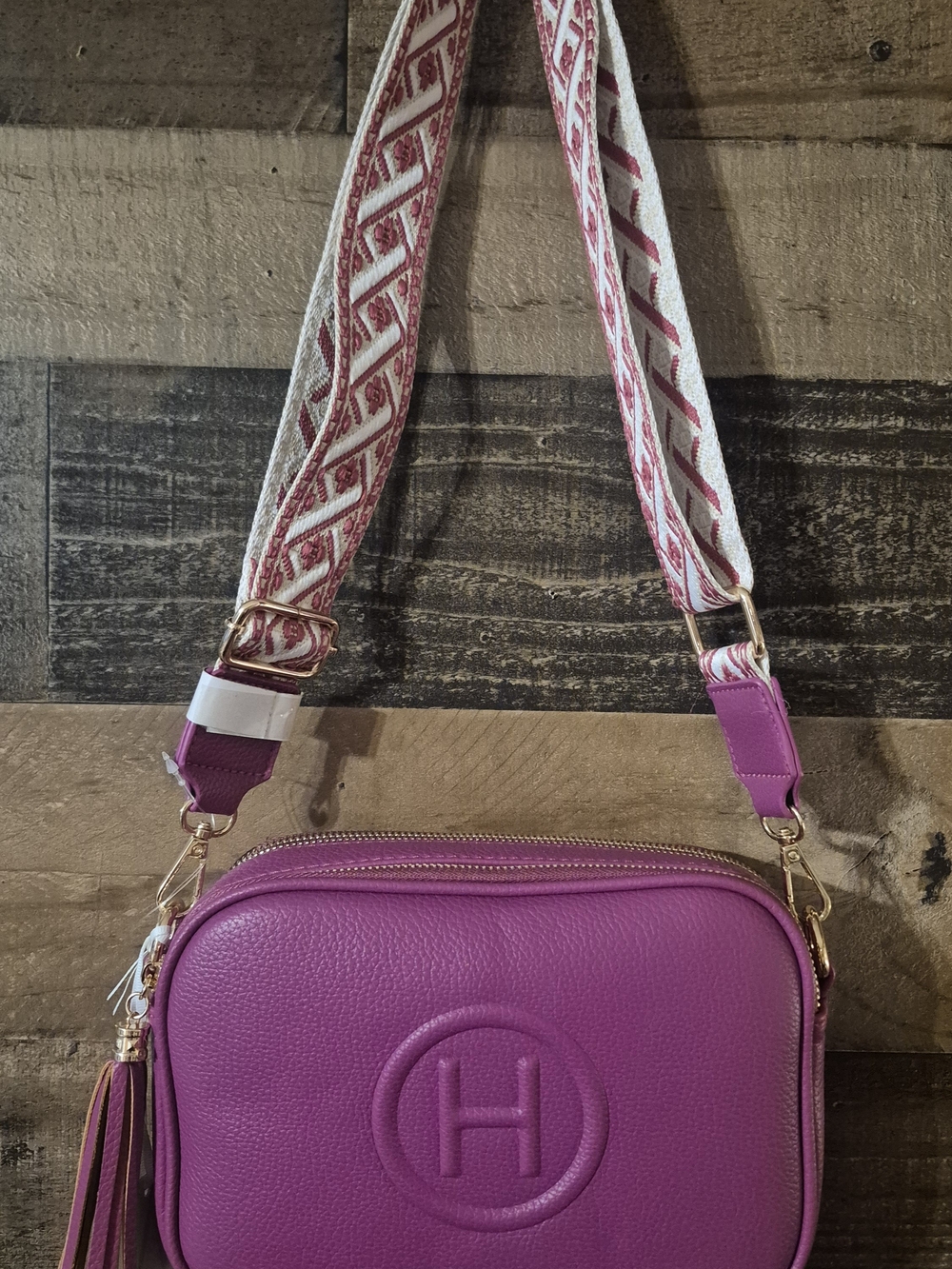 Compact Magenta Leather Crossbody with Decorative Strap